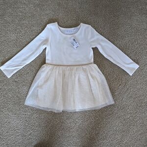 Girls toddler T2 cream colored dress with gold trim and little gold dots on tutu